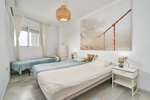 En eller flere senge i et værelse på Piso con vistas increibles del mar