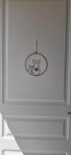 a light hanging from a ceiling in a room at homeliday ACTIVE in Caldana