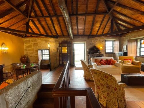 a large living room with couches and a table at Casa do Vale - Douro Valley Cottage in Resende