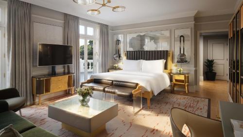 a hotel room with a bed and a television at Mandarin Oriental Hyde Park, London in London