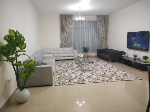 Prostor za sedenje u objektu Al Khor Tower Apartment
