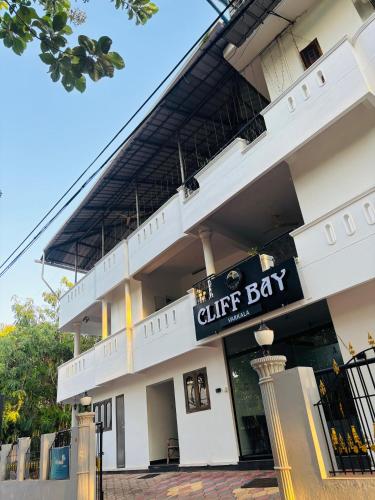 a building with a sign that reads the cliff bar at Cliff Bay in Varkala