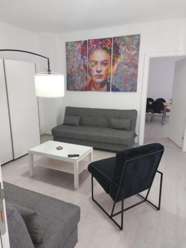 a living room with a couch and a table at Danka in Gornji Milanovac