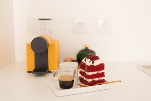 a piece of red velvet cake and a cup of coffee at CASASUPERTUBOS - Apart 9 in Peniche City Center in Peniche
