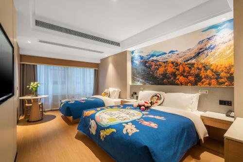 a hotel room with two beds and a painting on the wall at Atour X Hotel - Taikoo Li Chengdu in Chengdu
