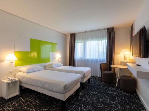 Postel nebo postele na pokoji v ubytování ibis Styles Chalon sur Saône