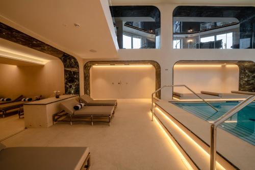 a room with a swimming pool on a boat at Excelsior Palace Portofino Coast in Rapallo