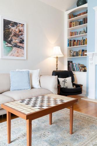 a living room with a couch and a coffee table at Riverside Charm - A stone's throw to the river in Barwon Heads
