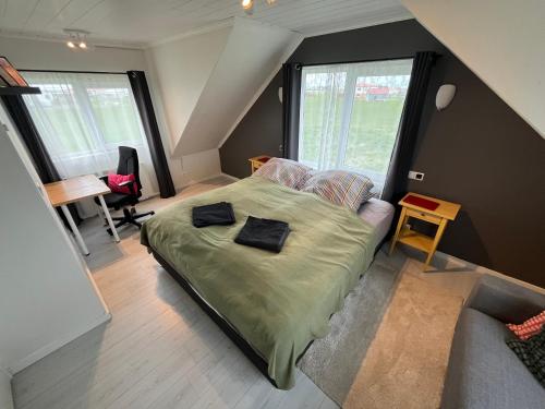 Postel nebo postele na pokoji v ubytování Luk House