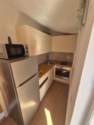 Kuchyň nebo kuchyňský kout v ubytování Summer Nest-Studio Apartment