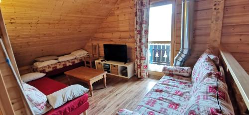 Ένα ή περισσότερα κρεβάτια σε δωμάτιο στο Chalet Aneloup vue d'exception à la Joue du Loup