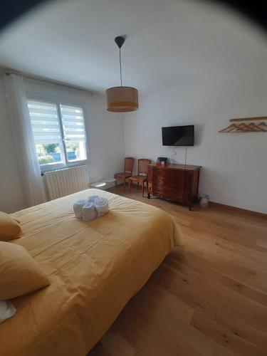 Posteľ alebo postele v izbe v ubytovaní Chambre à 5 minutes du circuit
