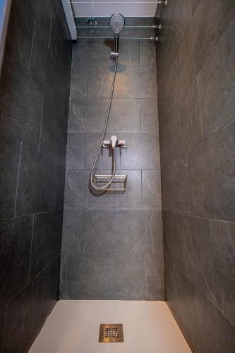 a bathroom with a shower with a toilet in it at Apartamento 23 en la muralla romana junto a la Catedral in Tarragona