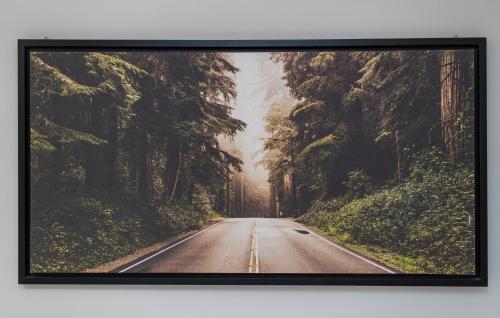 an image of a road through a forest at Travelershome Ciampino Suite in Ciampino