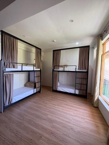 a room with two bunk beds in it at Summer house leh in ladakh