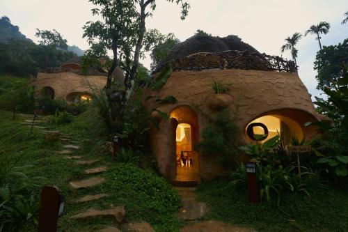 a small house in the middle of a forest at Toroland Munnar in Viripara