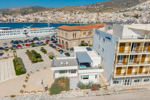 an aerial view of a city with buildings at NOS Suites in Ermoupoli