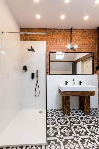 a bathroom with a sink and a shower at LivingRoom 4B Loft self Check-in 24h in Katowice