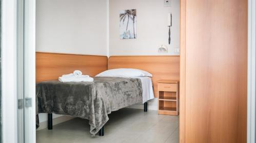 Postel nebo postele na pokoji v ubytování Hotel Fattori