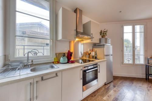 Køkken eller tekøkken på Le Sympathique - Metro 7 à 4 minutes - Direction Paris