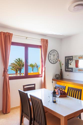 a dining room with a table and a window at Granillo Escape in Costa Calma
