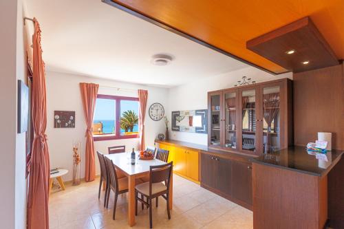 a kitchen with a table and a dining room at Granillo Escape in Costa Calma