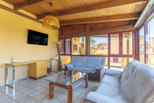 a living room with a couch and a table at Granillo Escape in Costa Calma