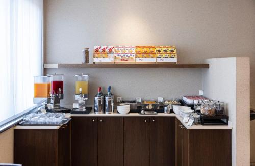 a kitchen with a counter with food on it at Hotel Nord in Guardamiglio