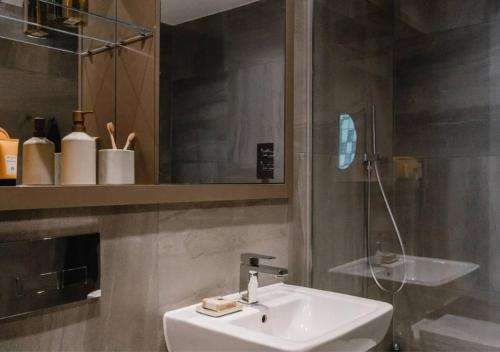 a bathroom with a sink and a mirror at Charles Hope Liverpool in Liverpool