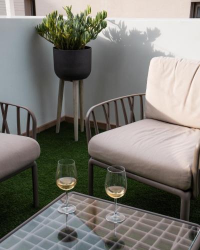 two glasses of white wine sitting on a table at Chez Abel in Las Palmas de Gran Canaria