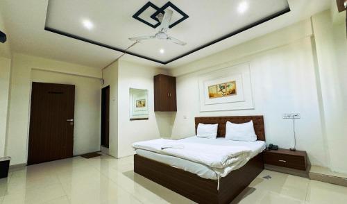Una cama o camas en una habitación de Hotel Palladium