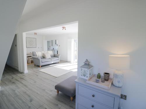 a living room with a couch and a table at New House Farm in Leamington Spa