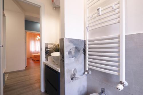 a bathroom with a sink and a toilet in a room at PrimoPiano - Padova 217A in Milan