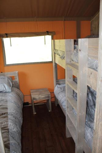 Postel nebo postele na pokoji v ubytování Camping Campo dei Fiori - Glamping4all