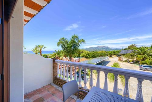 a balcony with a view of the ocean at Dulce Nombre Hotel - Apartamentos in Tarifa