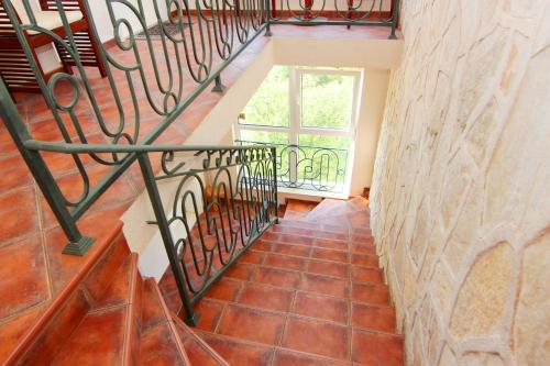 a staircase in a house with a tile floor at Mila & Aleksandr Apartments in Budva