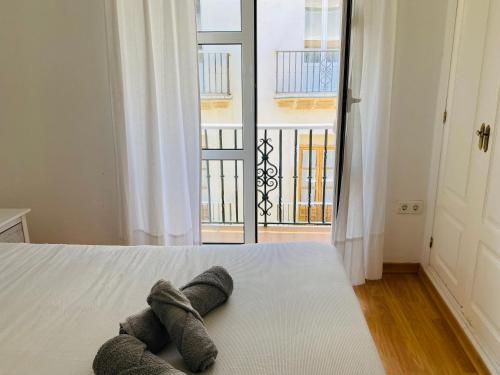 Katil atau katil-katil dalam bilik di Ático Cádiz Centro