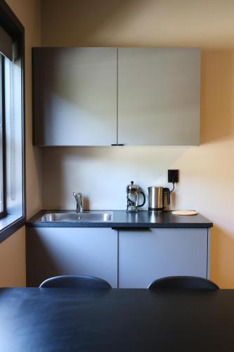 Kuchyň nebo kuchyňský kout v ubytování Flåmsbrygga Apartments