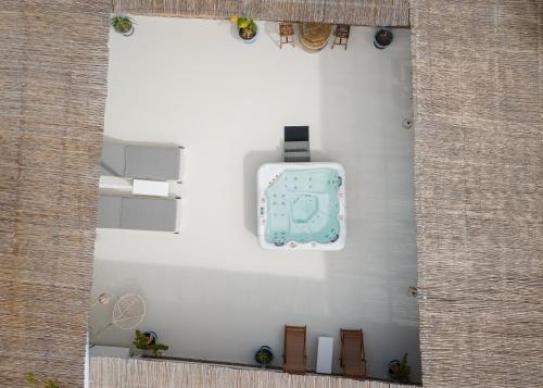 a view of a wall with a suitcase on it at Porfyra Suite 1 in Skala