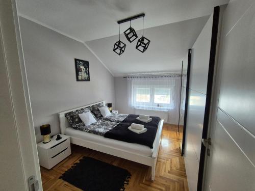 Postel nebo postele na pokoji v ubytování Queen Deluxe