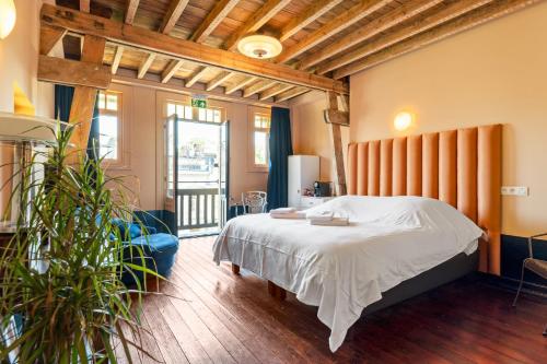 Postel nebo postele na pokoji v ubytování Boutique B&B Baron Osy