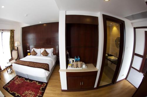 Voodi või voodid majutusasutuse Maya Manor Boutique Hotel by KGH Group toas