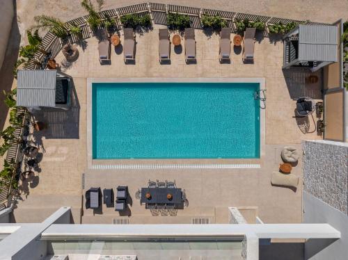 an overhead view of a swimming pool in a building at Arfna Villas in Afantou