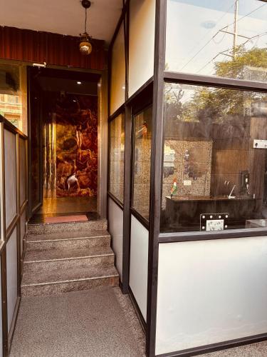 an entrance to a building with a glass door at JPM Suites Noida 70 in Noida
