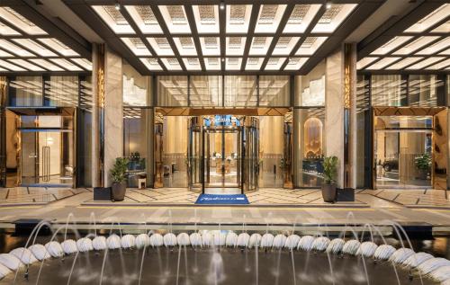 a lobby with a volleyball court in the center of a building at Radisson Blu Ha Long Bay in Ha Long