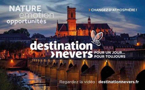 a picture of a bridge with a city in the background at Chalet et jacuzzi au coeur du Nivernais in Sauvages