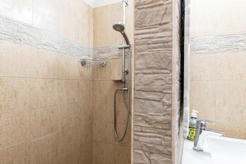 a shower with a shower head in a bathroom at GuestHost - Ca'Solare - Country Villa X4 in San Cristoforo de Valli