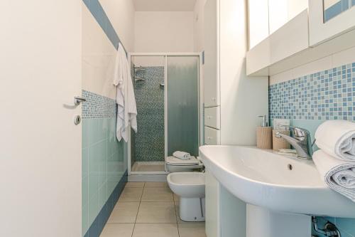 a bathroom with a sink and a toilet and a shower at il terrazzino di Marco e Francesca in Siena