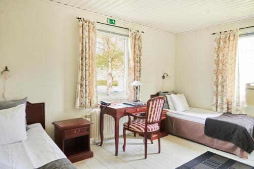 Postel nebo postele na pokoji v ubytování Hotell Björkhaga