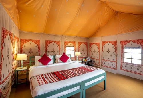 a bedroom with a bed in a tent at Jawai Vilas in Mori Bera